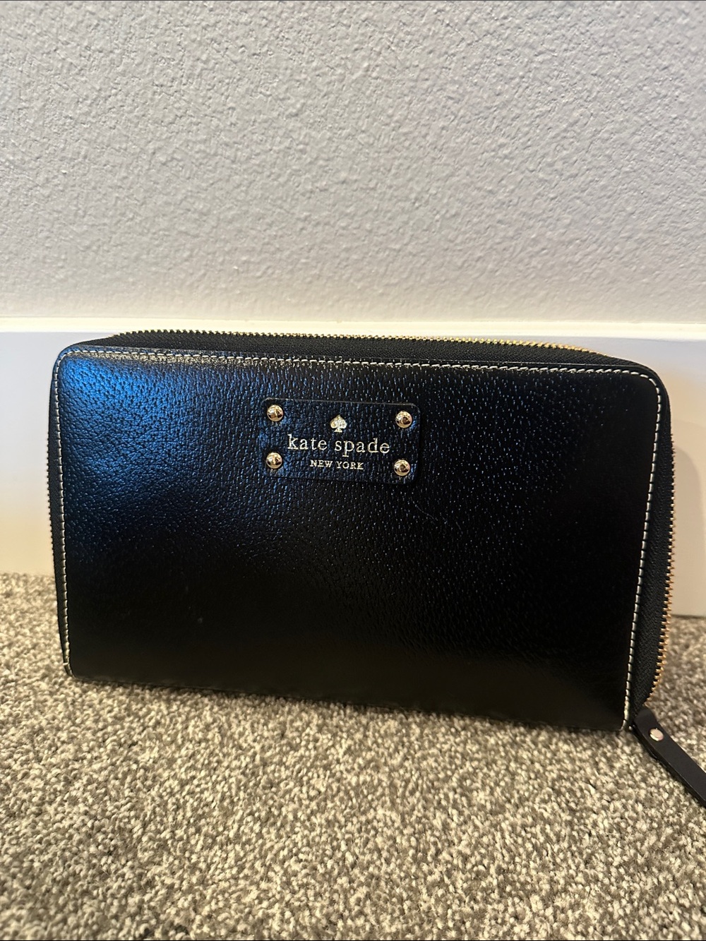 kate spade Black Pebbled Zip-Around Passport Wallet with Gold Plaque